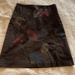 Slim, A-line skirt from Biden with colorful, stitched flowers.